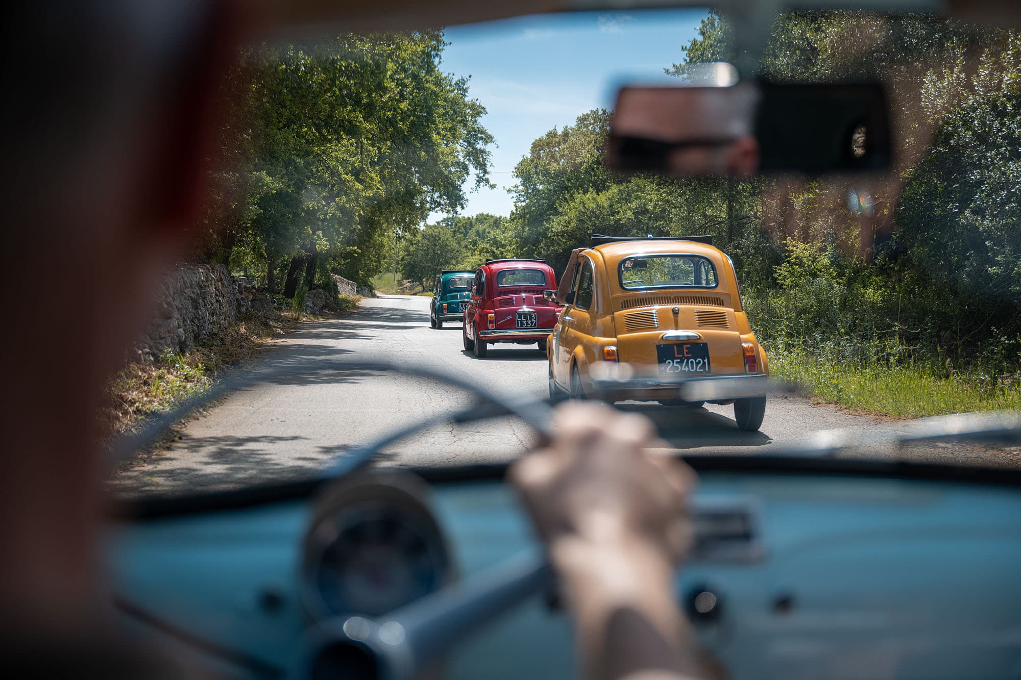 Vintage cars on a countryside road trip in Puglia